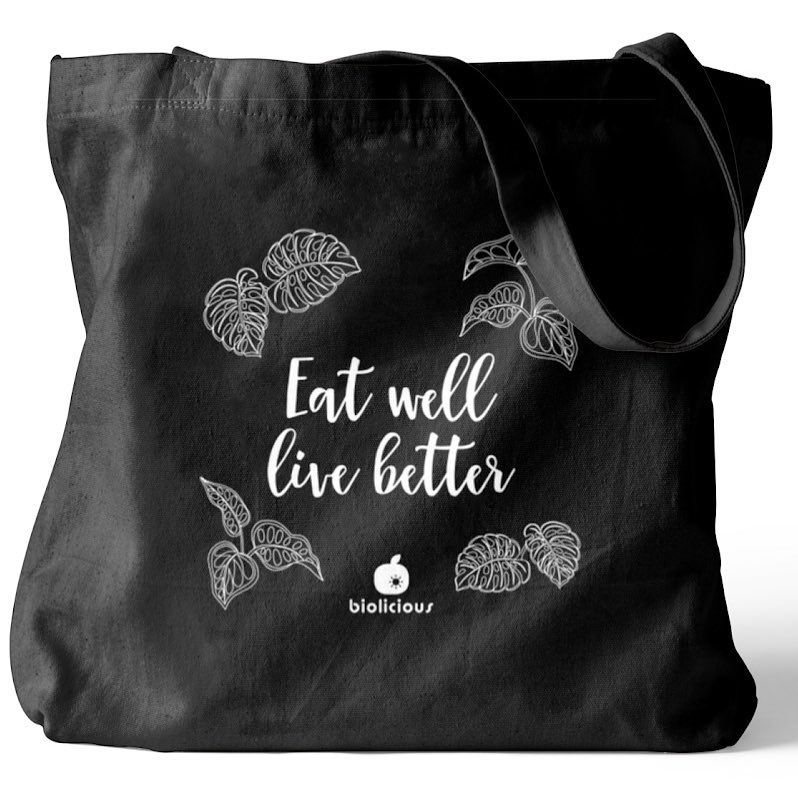Biolicious-shoppingbag met botanische illustraties en de tekst Eat well, live better